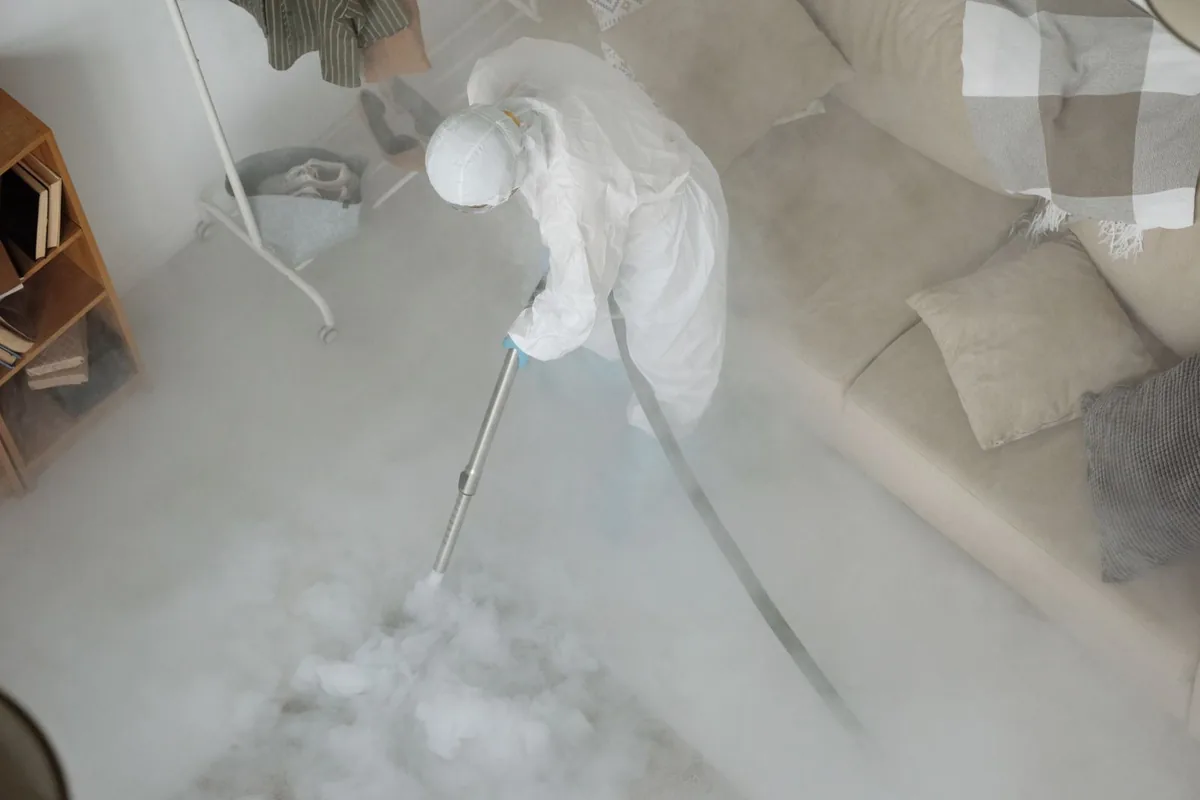 Biohazard cleanup technician in protective equipment, Cedar Falls, IA
